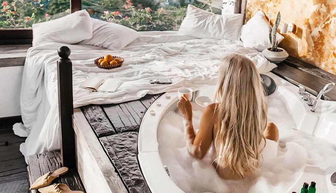 Girl enjoying a relaxing soak in Theva Residency Kandy jacuzzi
