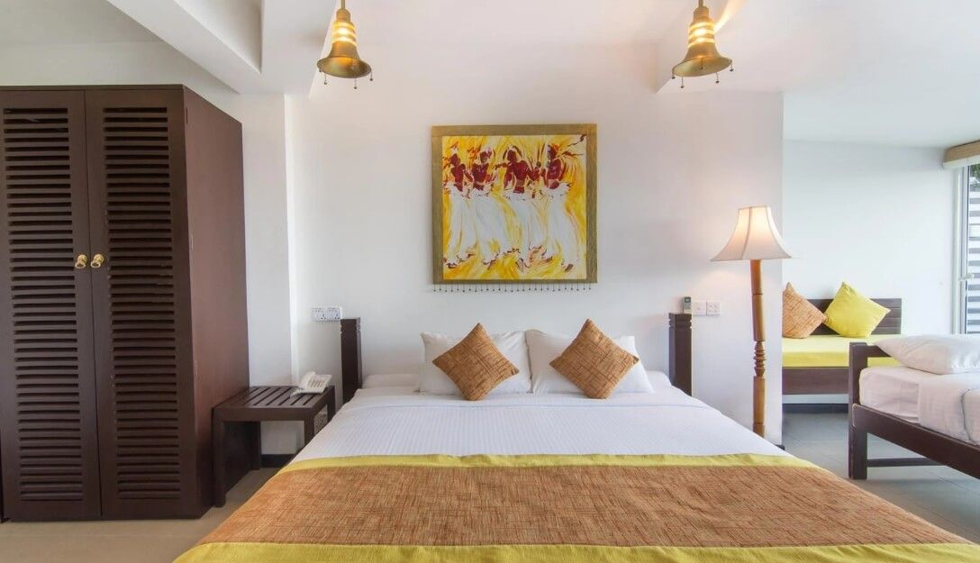 Stylish bed and wardrobe at Theva Superior Ground Rooms