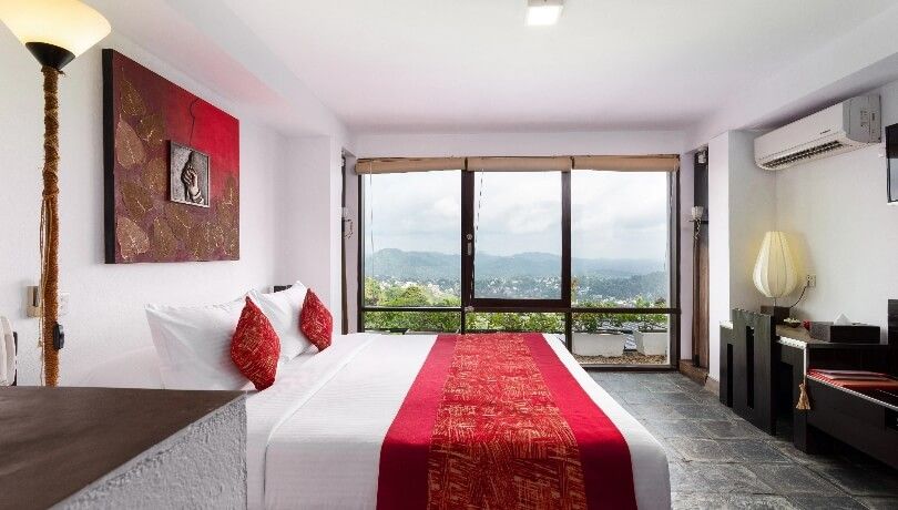 Deluxe room at Theva Residency Kandy featuring unique interior design
