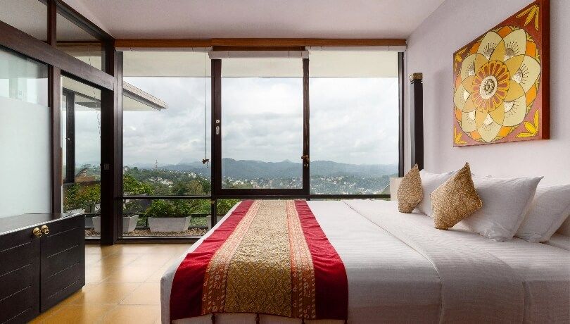 Theva Residency penthouse showcasing panoramic Hanthana mountain vistas